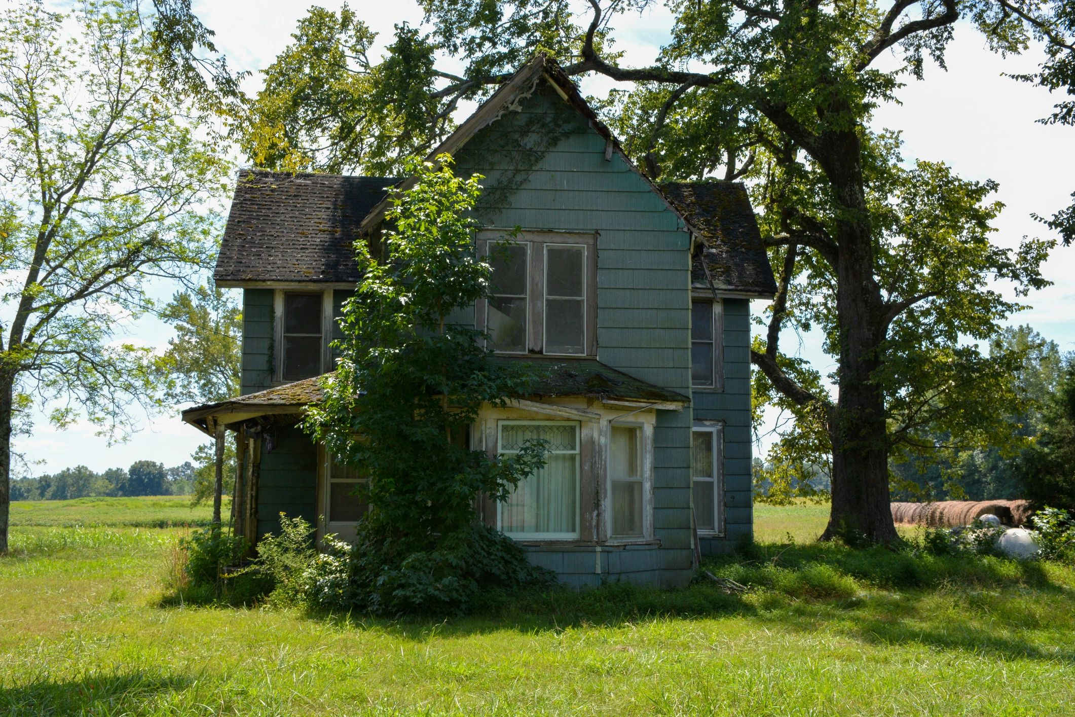 Older house exterior in distressed condition