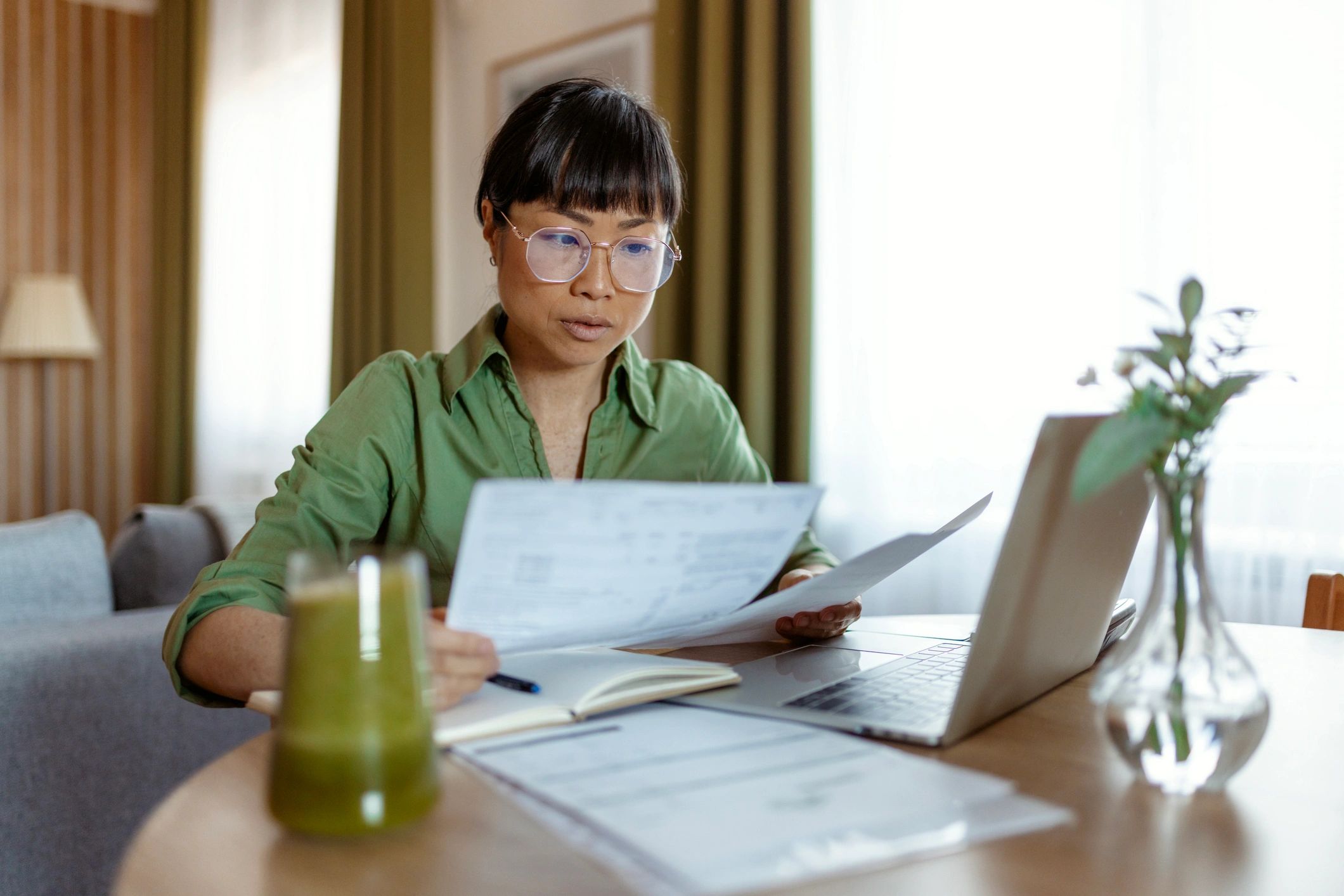 Homeowner reviewing paperwork at a table