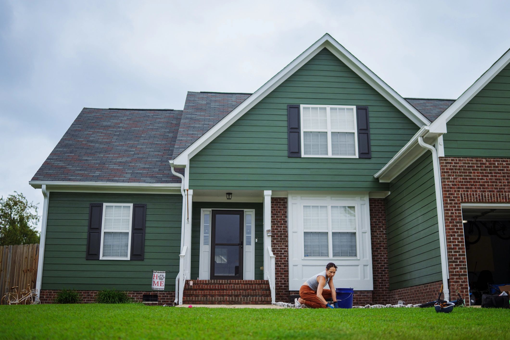 Homeowner outside a house
